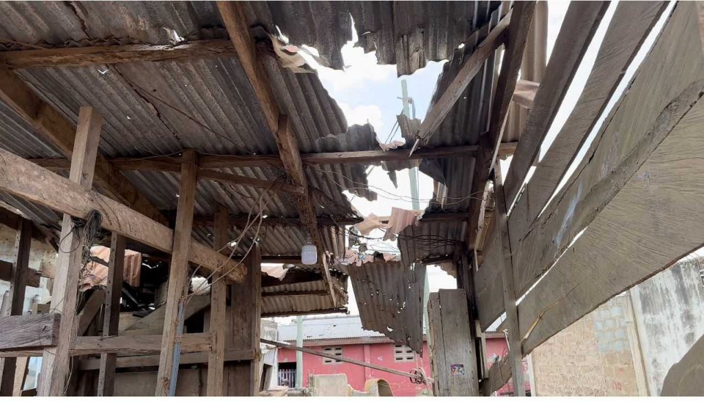 Workers at Buduburam road site implementing safety measures.